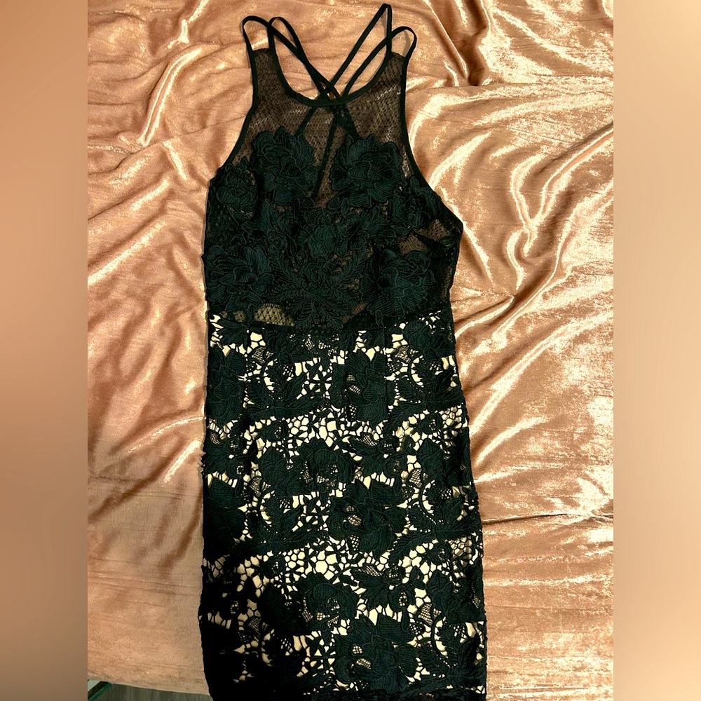 Black lace dress with nude sewn-in slip on the bottom